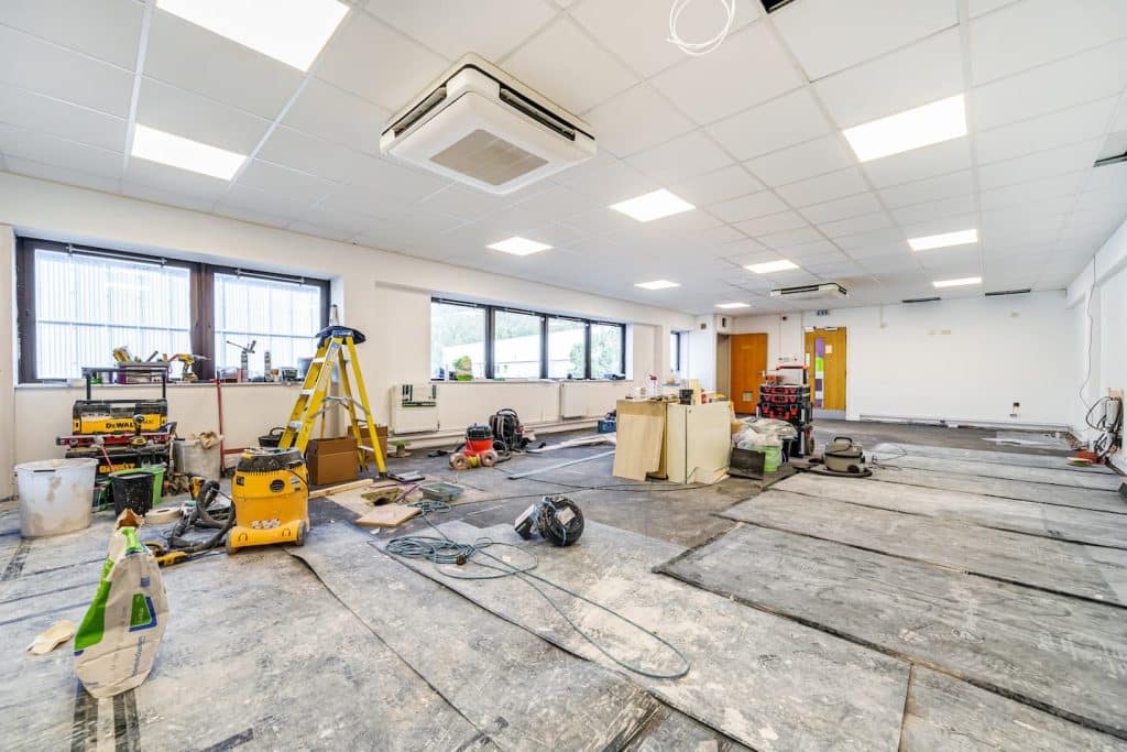 cat a fit out in commercial unit, plasterboard seen, ladders, tools and unfinished space