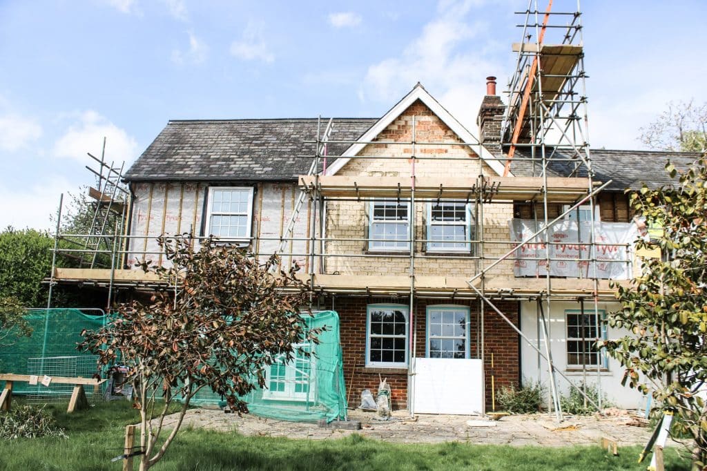 external home being renovated and developed with scaffolding on and numerous different works being completed.