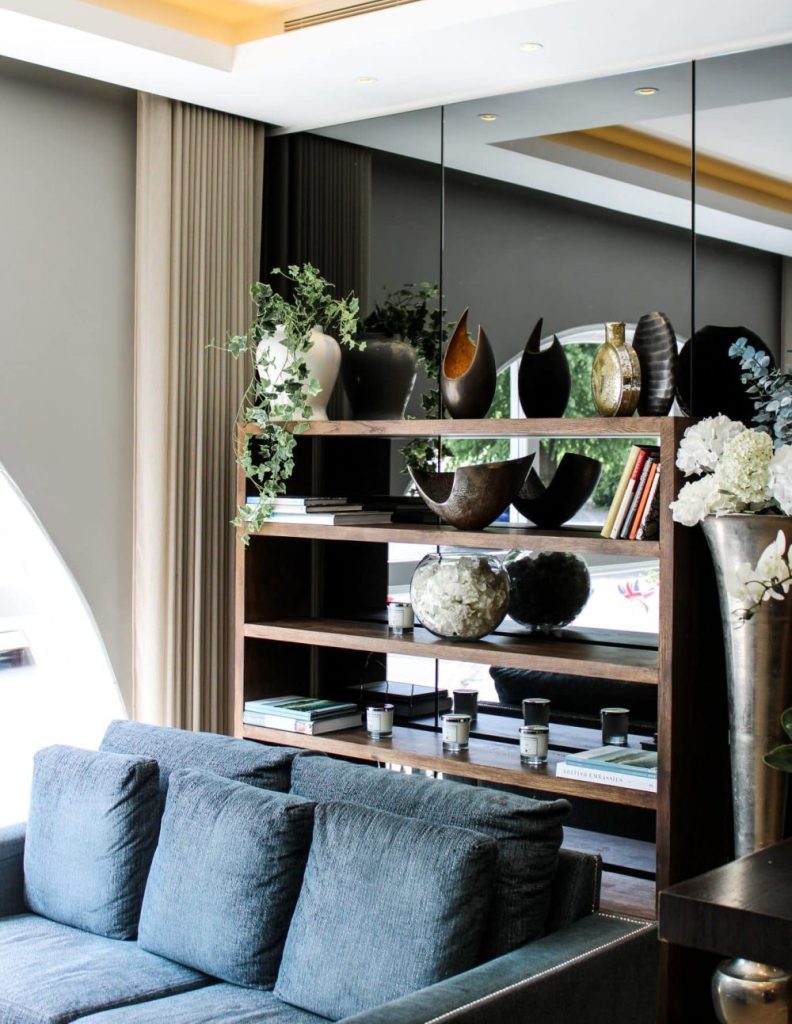 High-quality finish Charcoal coloured sofa with high end shelves
