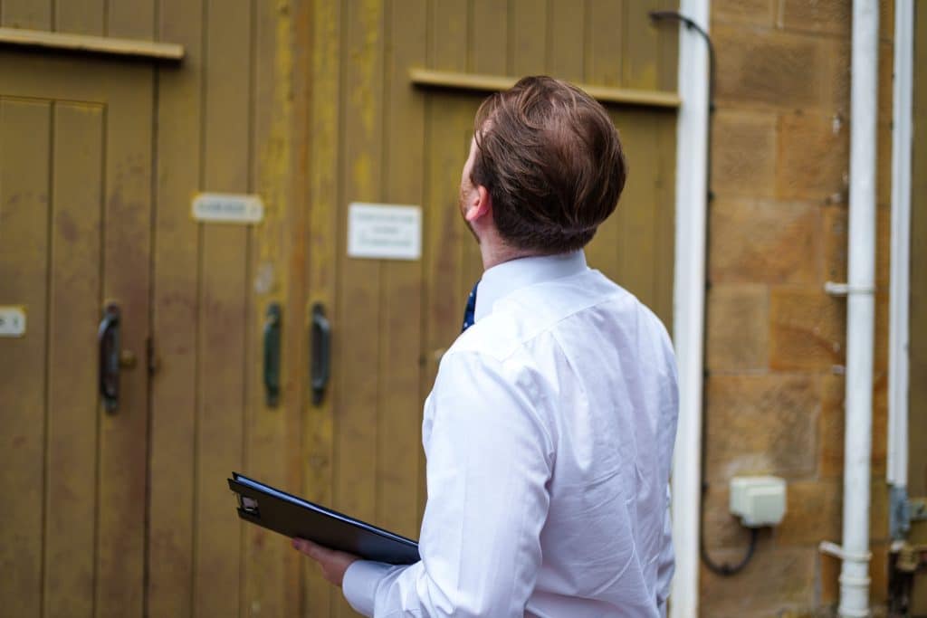 Man in office suit Commercial fit out sustainability review Sustainability checklist White shirt man office